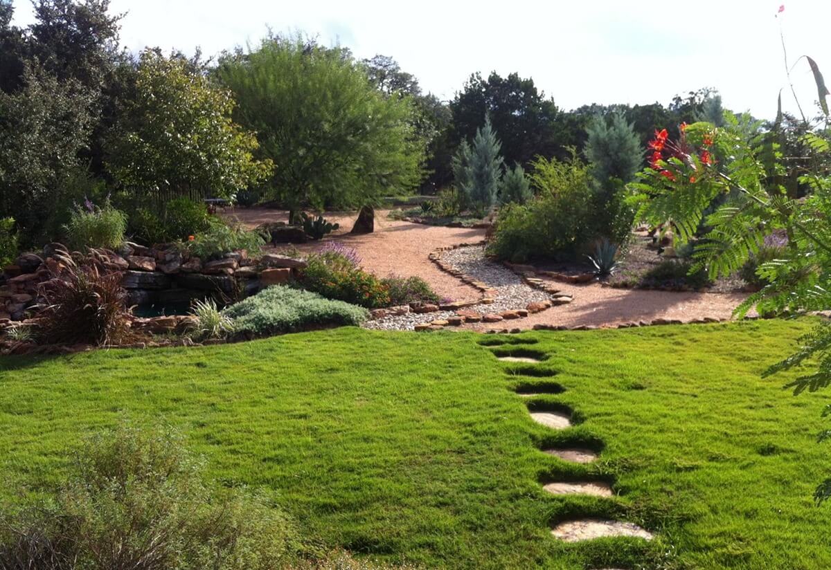 Garden with a stone pathway and established planting